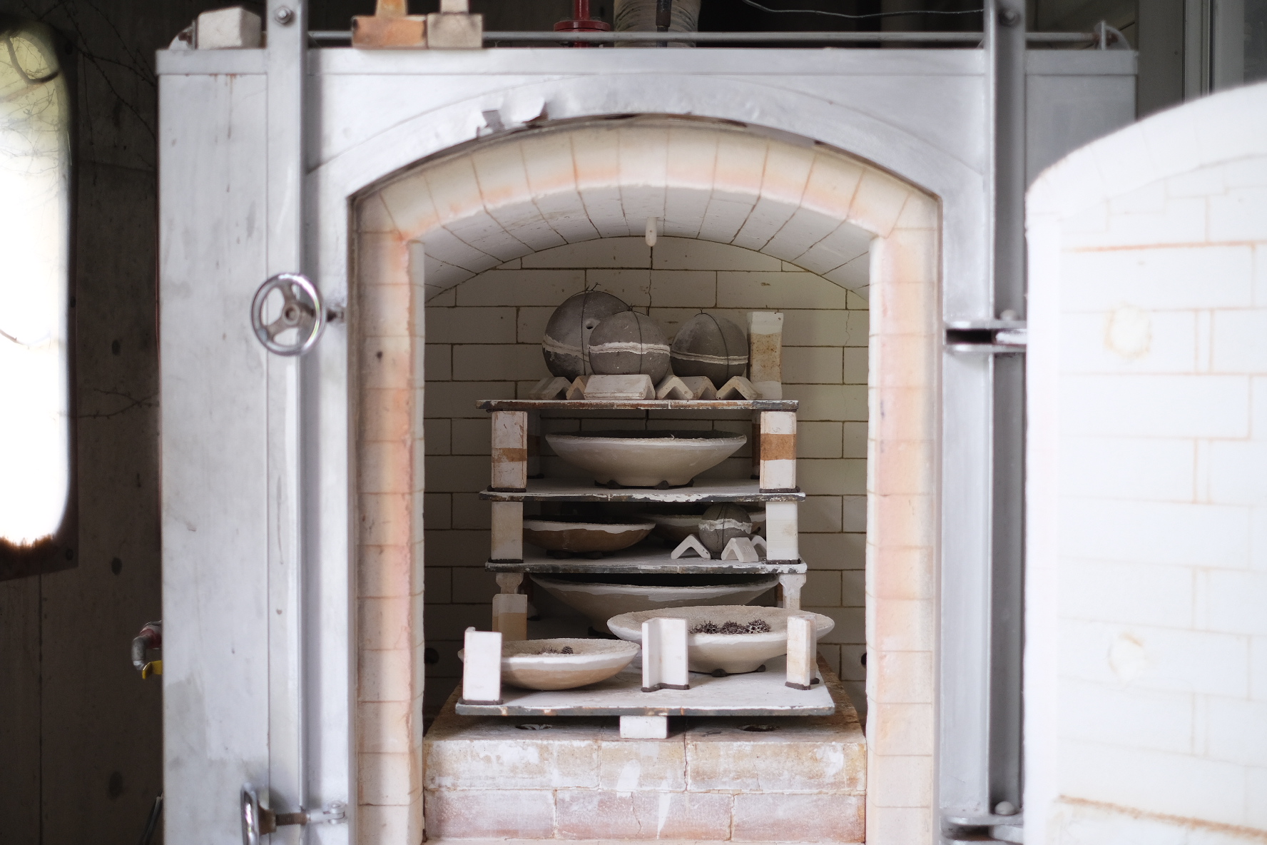 My ceramic works before being fired, arranged with the front-to-back method in the 0.4 cubic meter gas kiln.