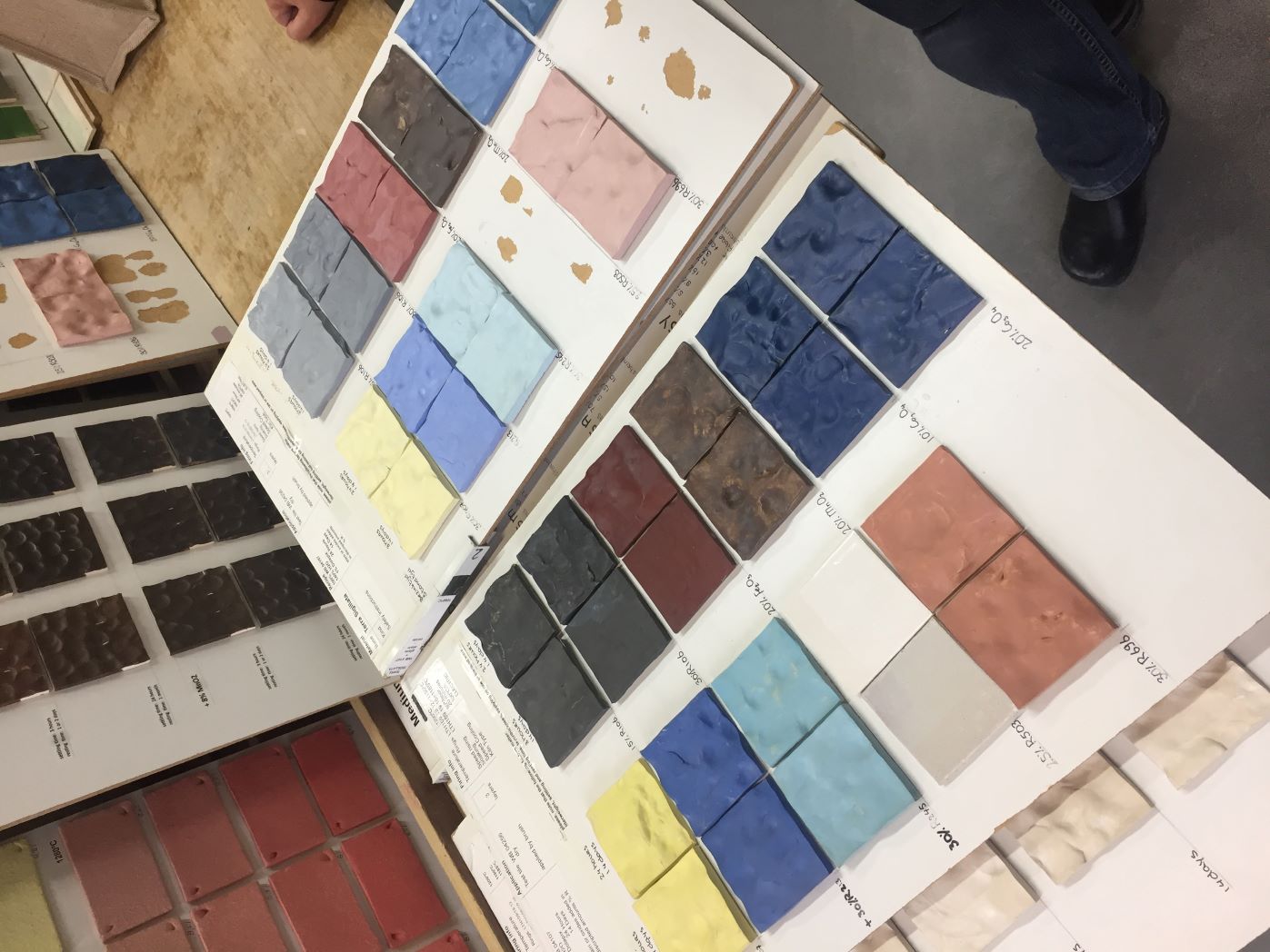 Glaze room sample: Meeting with advisors to discuss formulations, proportions, sequences, and blending principles.