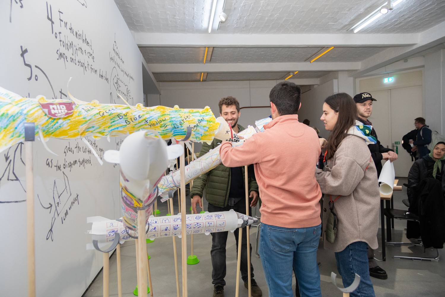 The exhibition space was gradually filled with paper missiles made by participants.