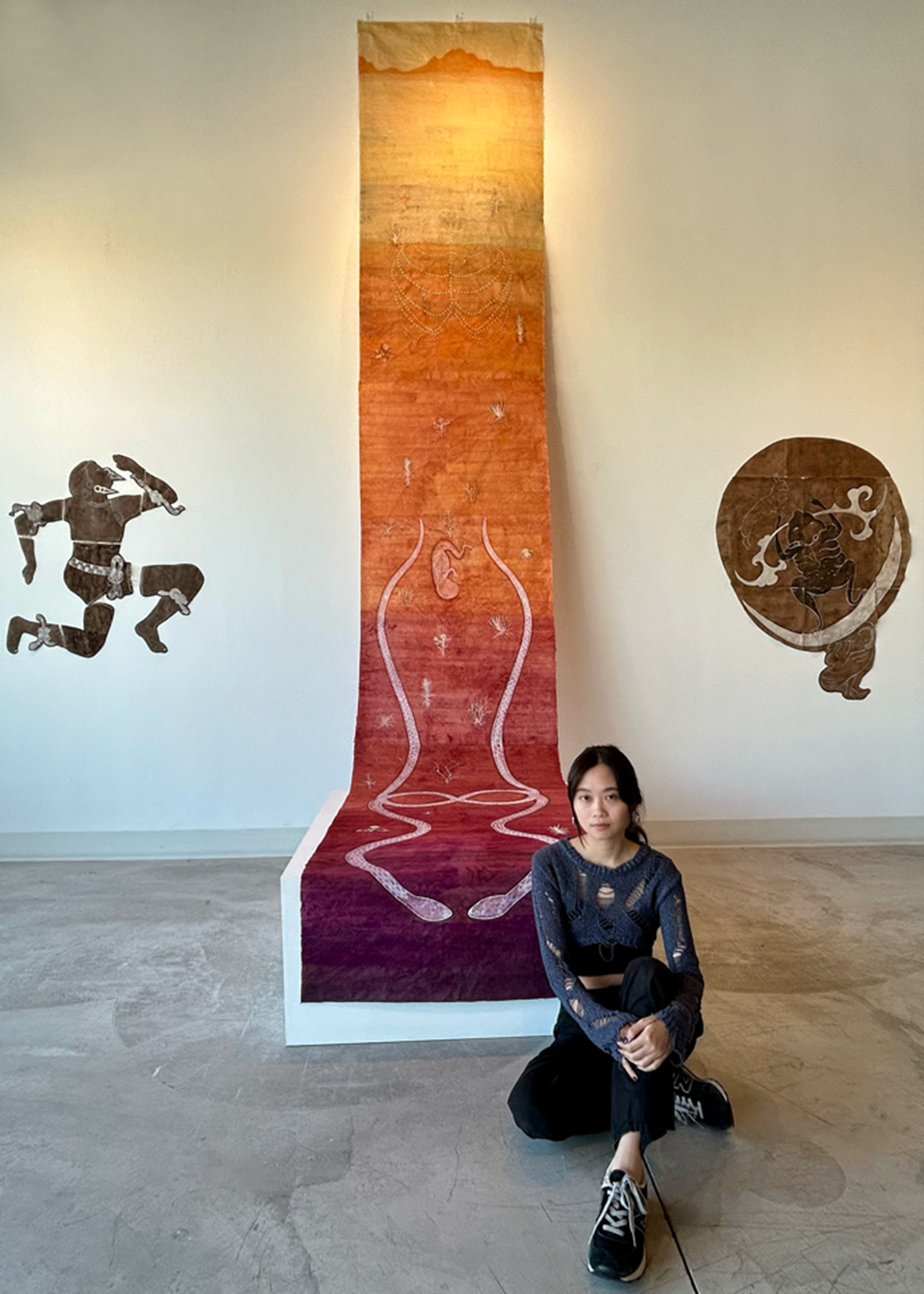 Artist Lu Wei with her work at Ogden Contemporary Arts, courtesy of Material.